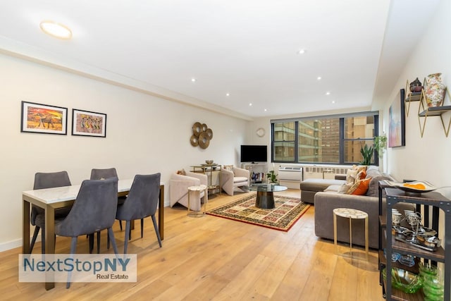 living area featuring recessed lighting and light wood-style floors