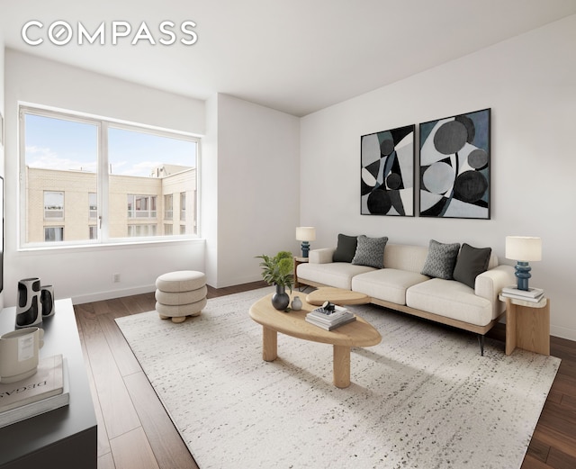 living area featuring baseboards and dark wood-type flooring