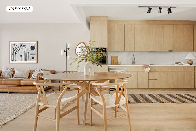 dining space featuring visible vents and light wood-type flooring