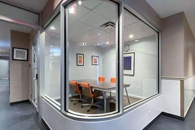 interior space featuring baseboards, recessed lighting, and visible vents