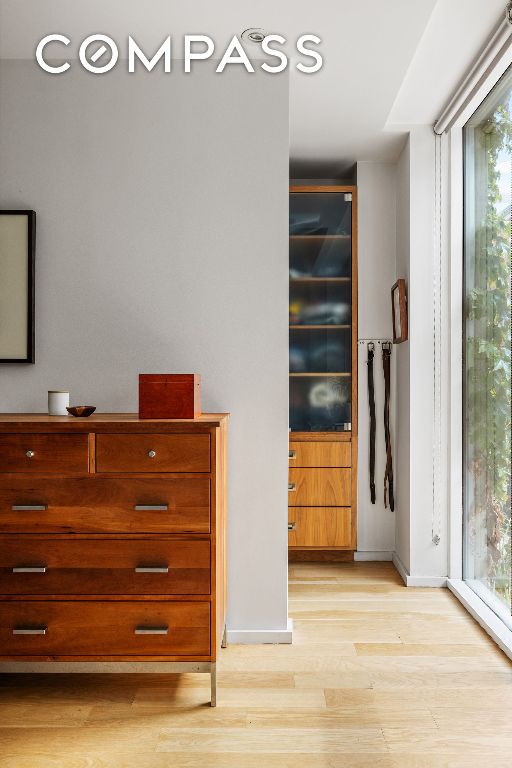 unfurnished bedroom with light wood-type flooring