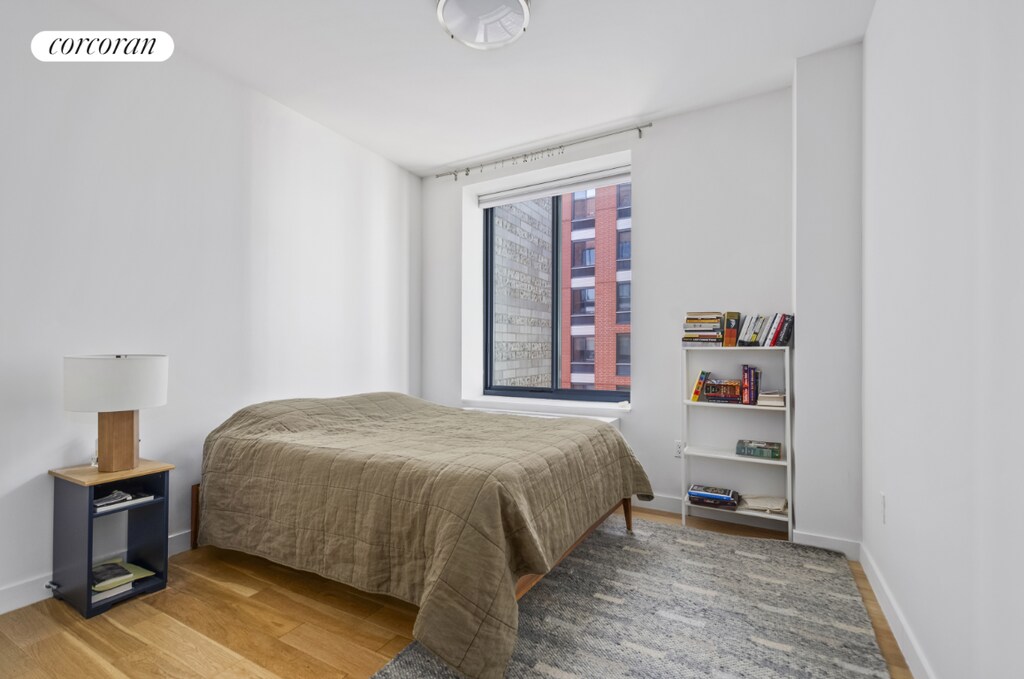 bedroom with wood-type flooring