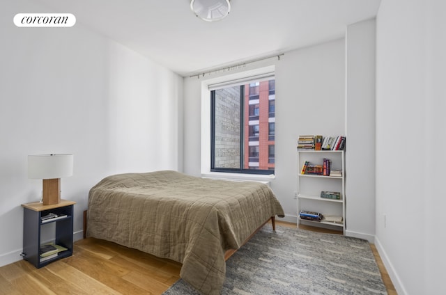 bedroom featuring hardwood / wood-style floors