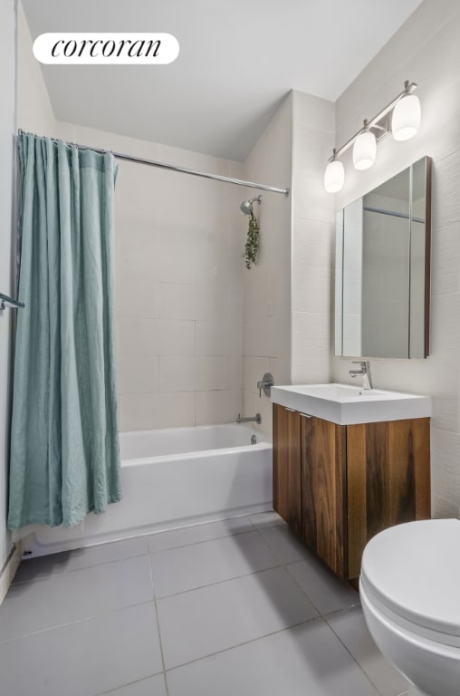 full bathroom with vanity, tile patterned floors, shower / bath combination with curtain, and toilet