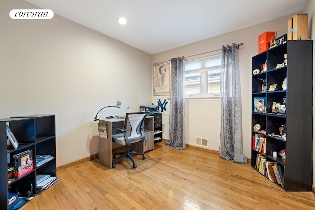 office area with recessed lighting, wood-type flooring, visible vents, and baseboards