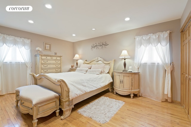 bedroom featuring recessed lighting, visible vents, and light wood-type flooring