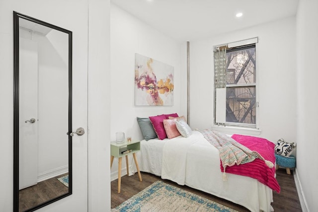 bedroom featuring dark wood-type flooring