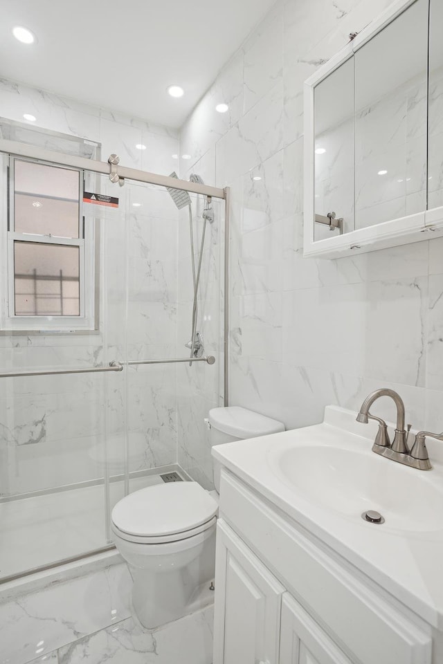 bathroom with toilet, marble finish floor, a marble finish shower, and tile walls