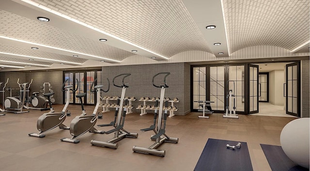 workout area with recessed lighting and vaulted ceiling