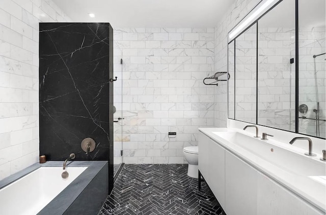 full bathroom featuring vanity, toilet, separate shower and tub, and tile walls