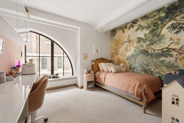 carpeted bedroom featuring baseboards