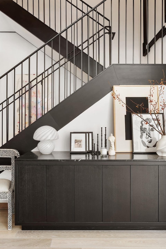 stairs featuring wood finished floors