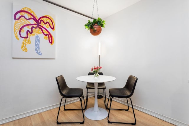 dining area featuring wood-type flooring