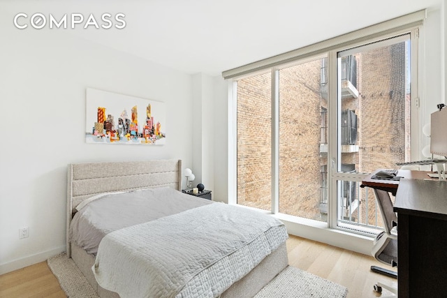 bedroom with light wood-type flooring