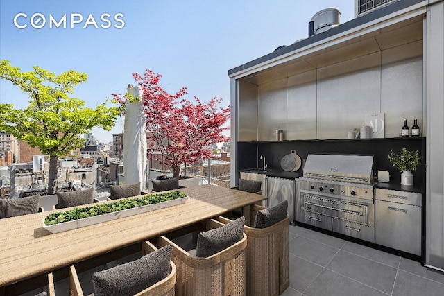 view of patio with area for grilling and sink