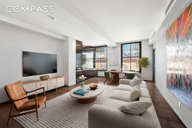 living room with dark hardwood / wood-style flooring