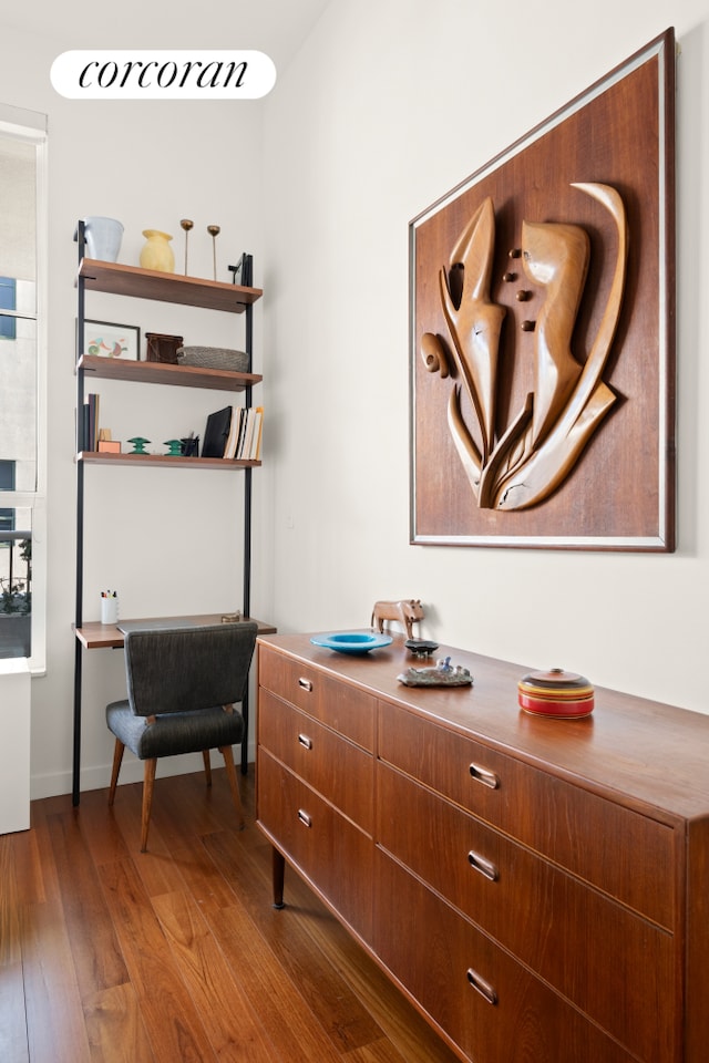 details featuring wood finished floors and baseboards