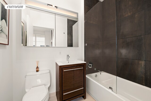 bathroom featuring vanity, toilet, and  shower combination
