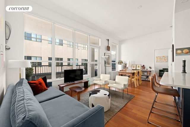 living room with visible vents and wood finished floors