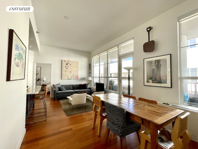 dining area featuring visible vents and wood finished floors