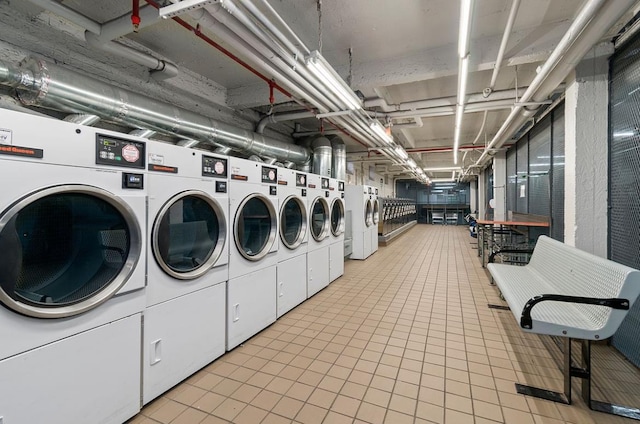 community laundry room featuring washer and clothes dryer