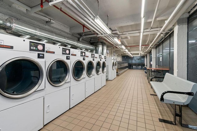 clothes washing area with independent washer and dryer