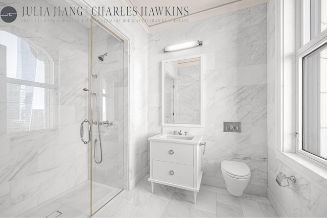 bathroom featuring plenty of natural light, marble finish floor, a marble finish shower, and toilet