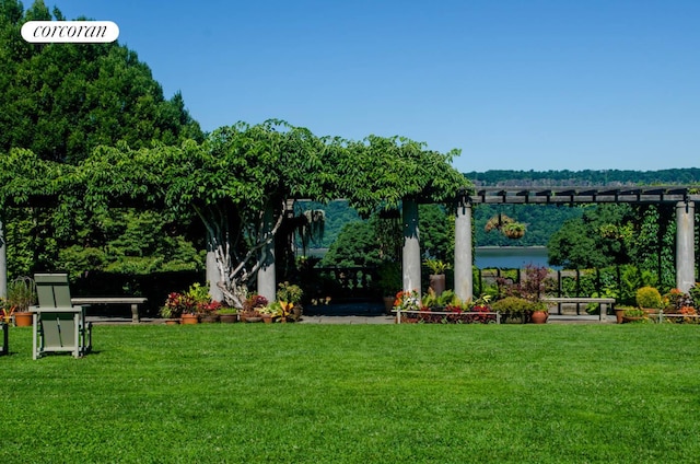 640 W 237th St Unit 7B, New York City, NY 10463 - view of grassy yard featuring a pergola