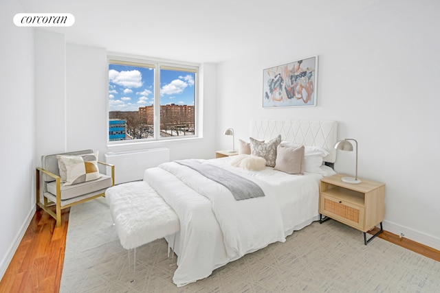 640 W 237th St Unit 7B, New York City, NY 10463 - bedroom with light wood finished floors and baseboards