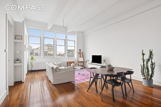 living room with hardwood / wood-style flooring and beam ceiling