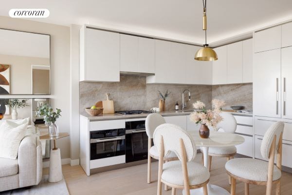 kitchen with black oven, decorative light fixtures, white cabinets, stainless steel oven, and gas cooktop