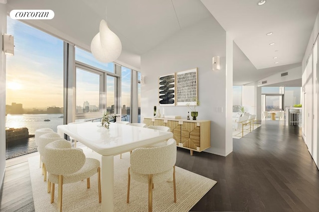 dining room featuring visible vents, floor to ceiling windows, dark wood-type flooring, and recessed lighting