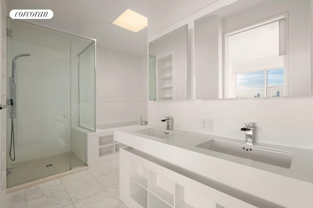 bathroom with marble finish floor, a shower stall, visible vents, and a sink