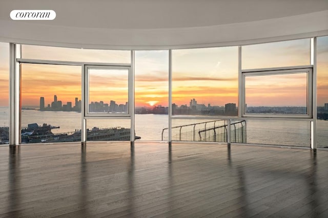 interior space featuring a view of city, visible vents, and wood finished floors