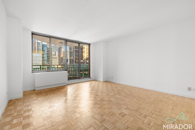 spare room featuring light parquet flooring