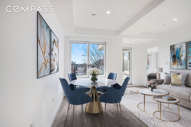 dining area with hardwood / wood-style floors