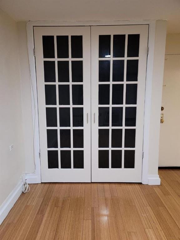 doorway to outside with hardwood / wood-style flooring and french doors