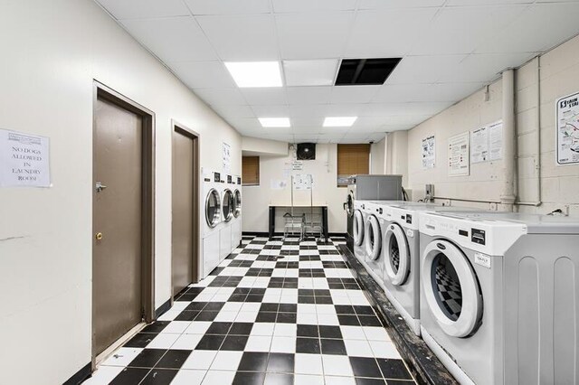 clothes washing area featuring washer and dryer