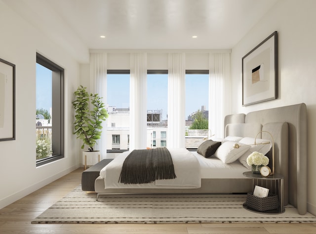 bedroom with multiple windows, baseboards, wood finished floors, and recessed lighting