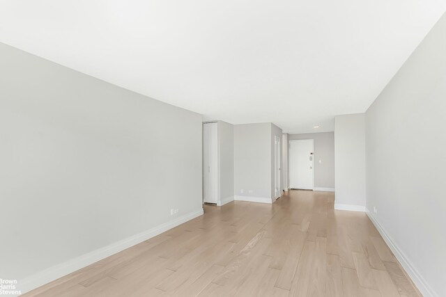 spare room with light wood-type flooring