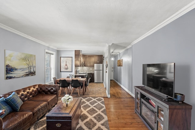 living room with crown molding and dark hardwood / wood-style floors