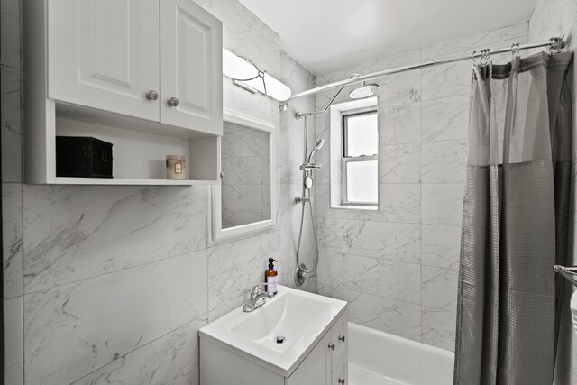 bathroom with vanity and shower / tub combo