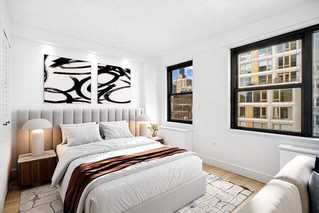 bedroom with light hardwood / wood-style flooring