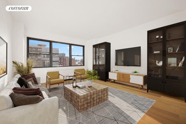 living area with light wood-type flooring and visible vents