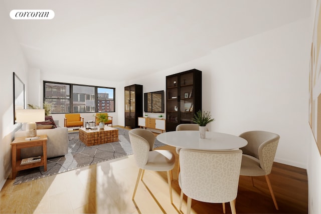 dining space with light hardwood / wood-style floors