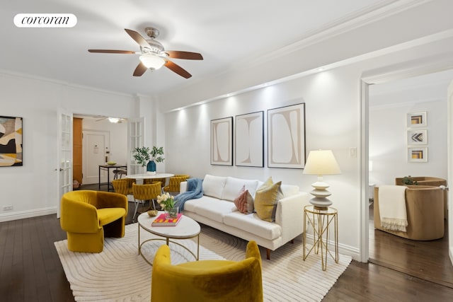 living area featuring hardwood / wood-style floors, ceiling fan, crown molding, and visible vents