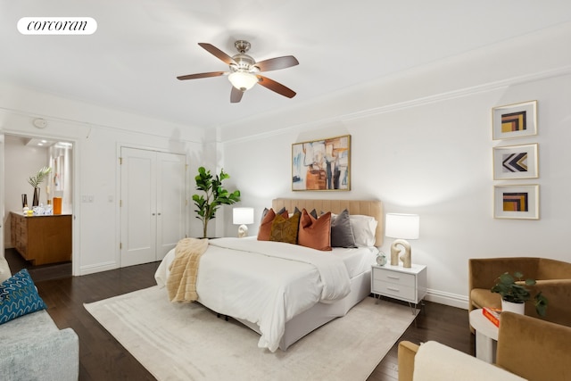 bedroom with visible vents, a ceiling fan, a closet, and wood finished floors