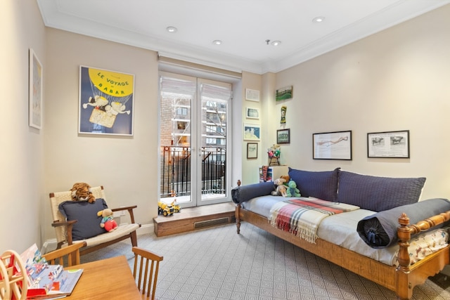 living area with ornamental molding and carpet