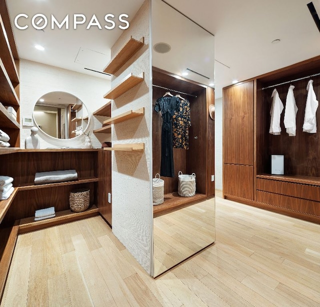 spacious closet with light wood-type flooring