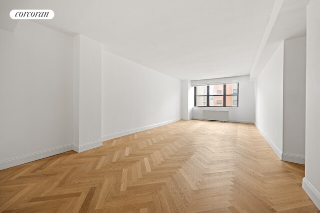 spare room featuring light parquet floors